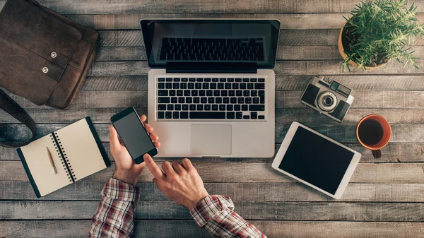 Hipster desktop with male hands — Stock Photo, Image