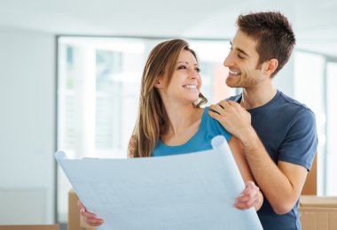 Young couple planning their new house clipart