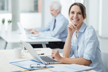 Smiling business woman at work clipart