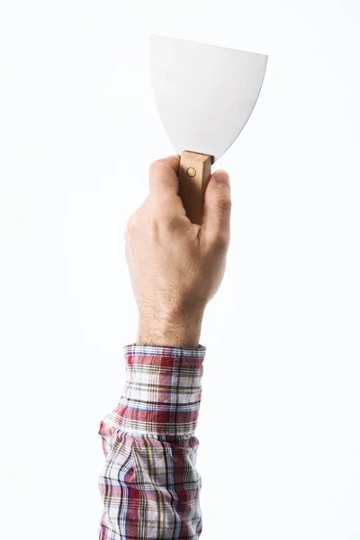 Hand holding a plaster spatula — Stock Photo, Image