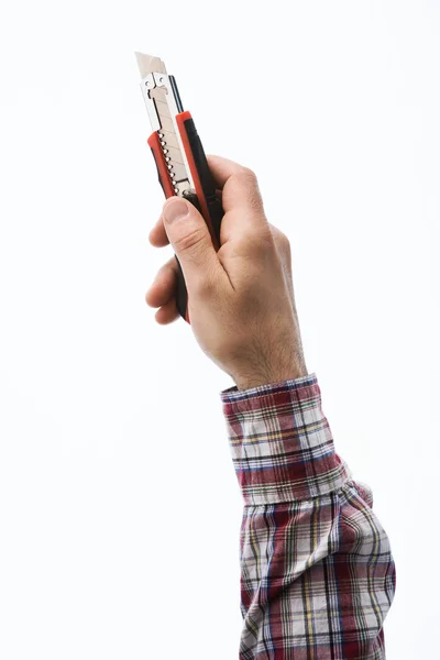 Hand holding a cutter — Stock Photo, Image