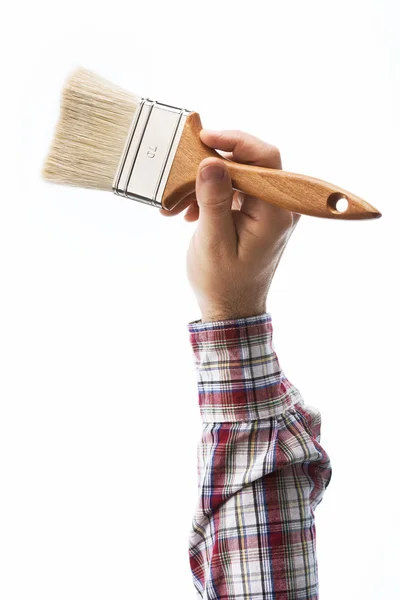 Decorator holding a paintbrush — Stock Photo, Image