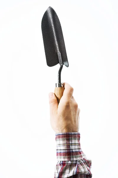 Hand holding a gardening shovel — Stock Photo, Image