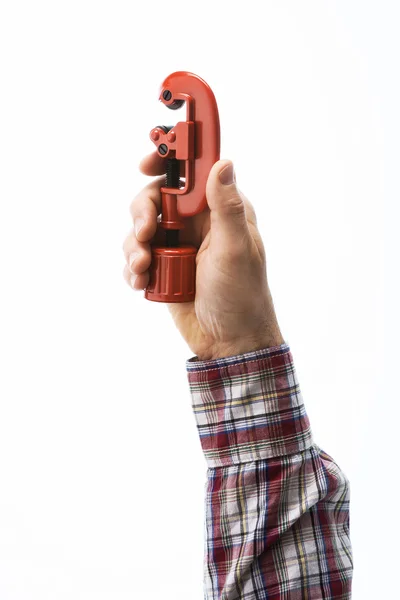 Hand holding a pipe cutter Stock Picture