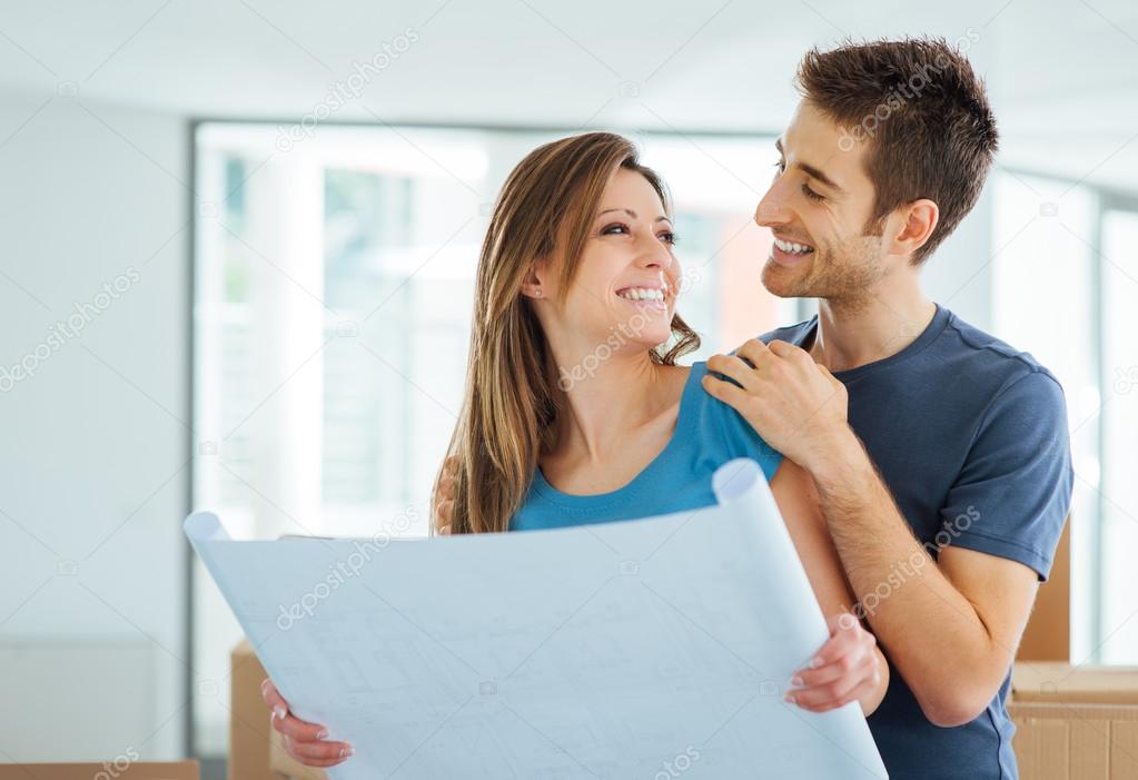 Young couple planning their new house