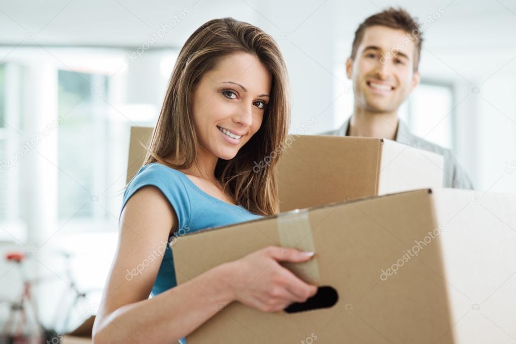 Young couple moving in a new house