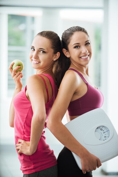 Happy girls dieting and losing weight