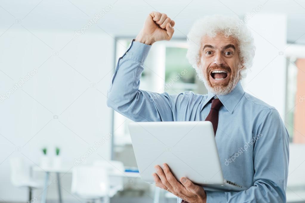 Cheerful businessman receiving good news