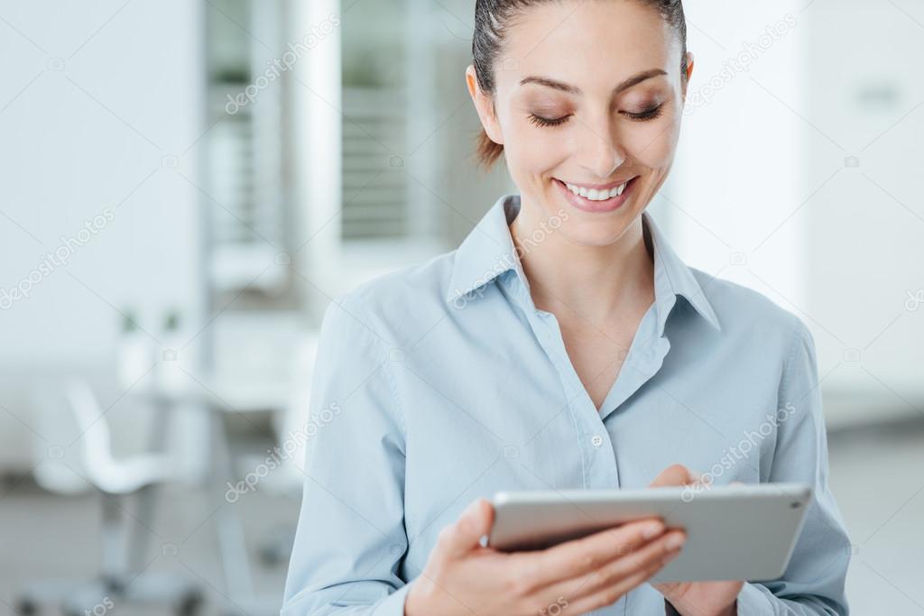 Young business woman using a digital tablet