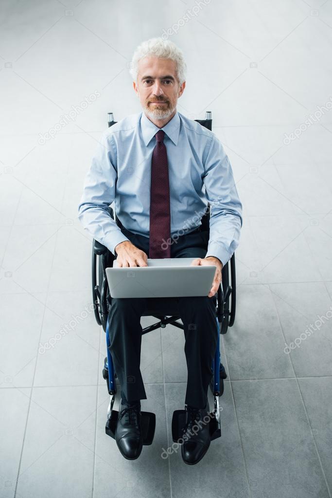 Confident businessman in wheelchair