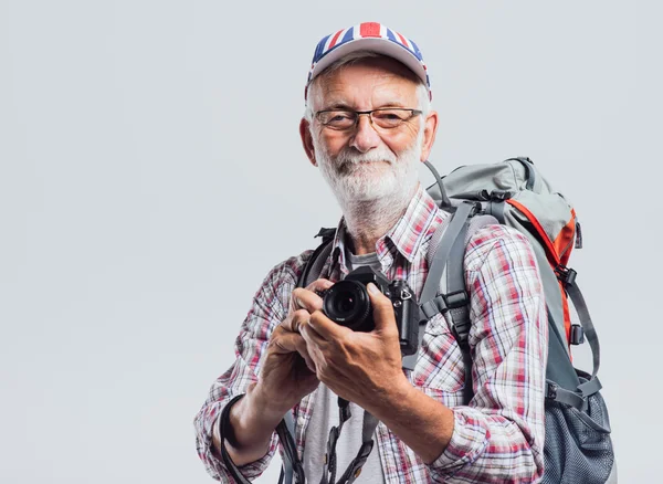 Senior adventurer and photographer — Stockfoto