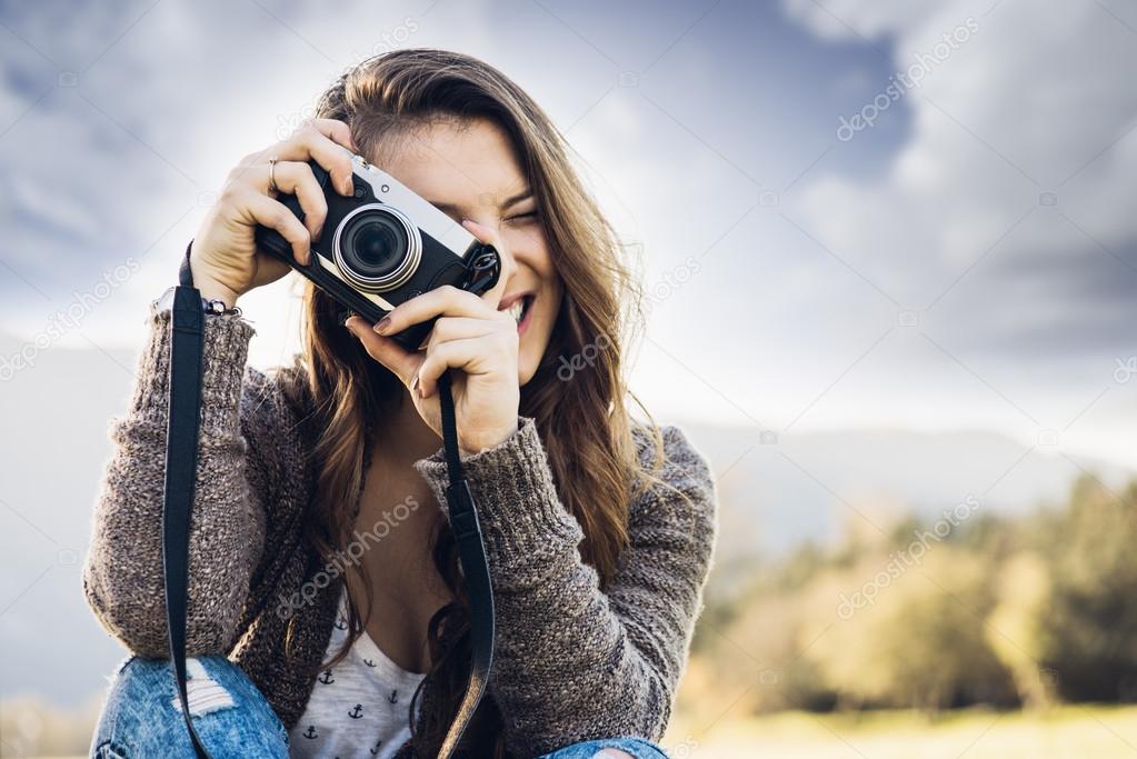 Young photographer shooting in nature