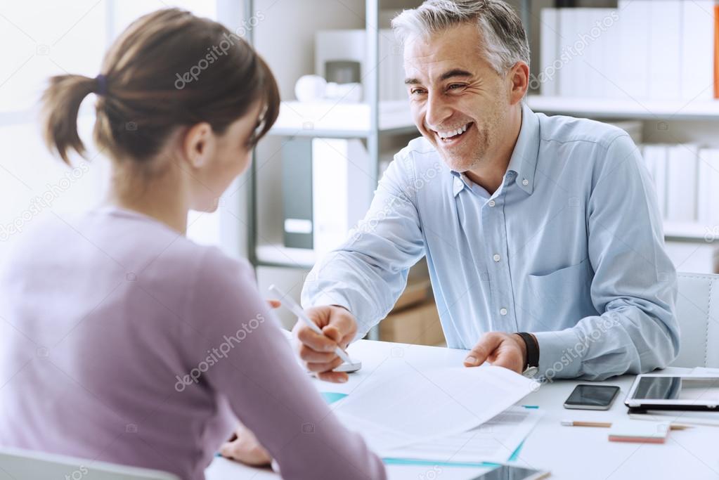 Woman signing a contract