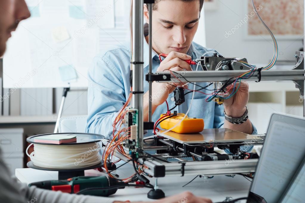 Students using a 3D printer