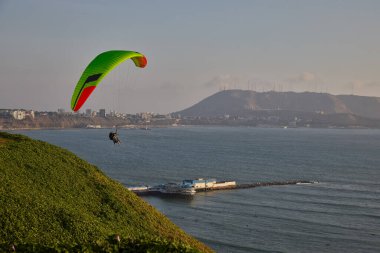 Paragliders soaring above the cliffs as the Pacific unfolds below, blending adrenaline, freedom, and Limas iconic coastal landscape into one unforgettable flight.