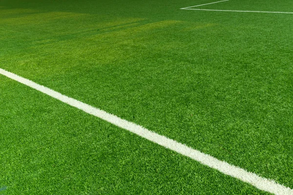 green artificial grass football field with white line sport background