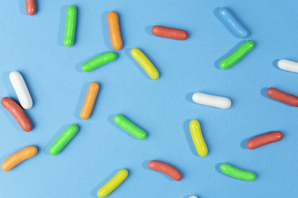 Colorful candies and sweets .Multicolored sugar sprinkles background.Creative Top view.