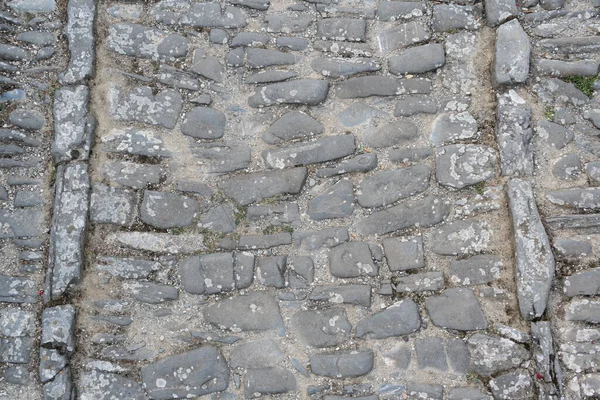 Old stone path texture.Pattern wall ancient european , medieval cobblestone pavement background.