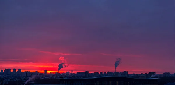 Red dawn over the city from the window. Early morning