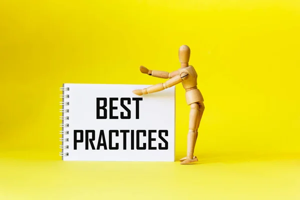 Best Practices Text Written Notebook Next Wooden Doll Yellow Background Fotografias De Stock Royalty-Free