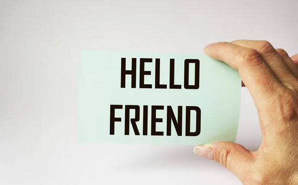 Woman Hand Holds Sticker Text Hello Friend White Background — Stock Photo, Image