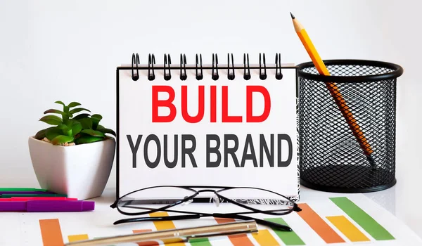 Блокнот Інструментами Нотатками Текстом Build Your Brand Business — стокове фото