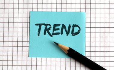 TREND, bu ifade renkli çıkartmalara, not defterine yazılmıştır. İş konsepti