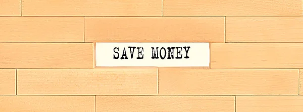 SAVE MONEY text on the wooden block wall, business