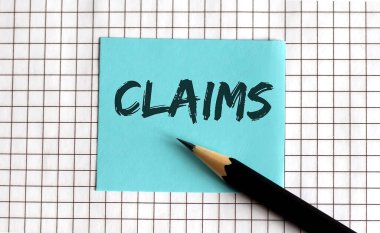 CLAIMS, bu ifade renkli etiketler üzerine yazılmış, bir not defteri arkaplanına. İş dünyası