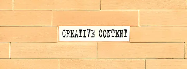 Creative Content text on wooden block wall, business