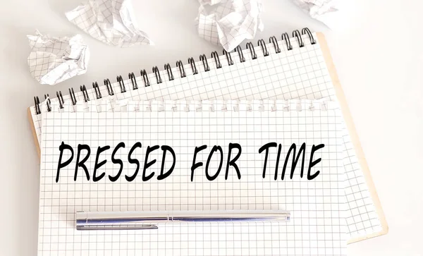 PRESSED FOR TIME - the text is written on Notepad with pen
