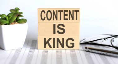 CONTENT IS KING - words wooden blocks with letters, the time is now concept