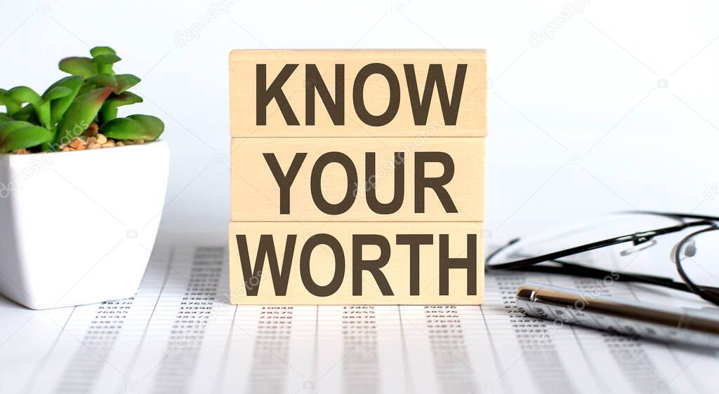 Know Your Worth - words from wooden blocks with letters,