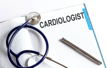Paper with text CARDIOLOGIST on a table with stethoscope