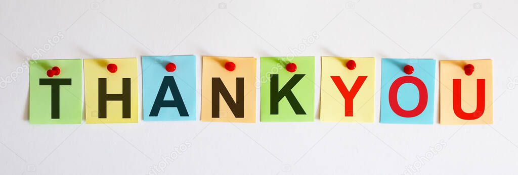 THANK YOU phrase is written on multi-colored stickers, on the white background. Business concept, strategy, planning.