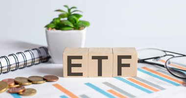 Grafik, sikke, defter, gözlüklü ETF kelime konsepti.