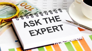 Defterde dolar ile birlikte yazılmış Uzman metne sor