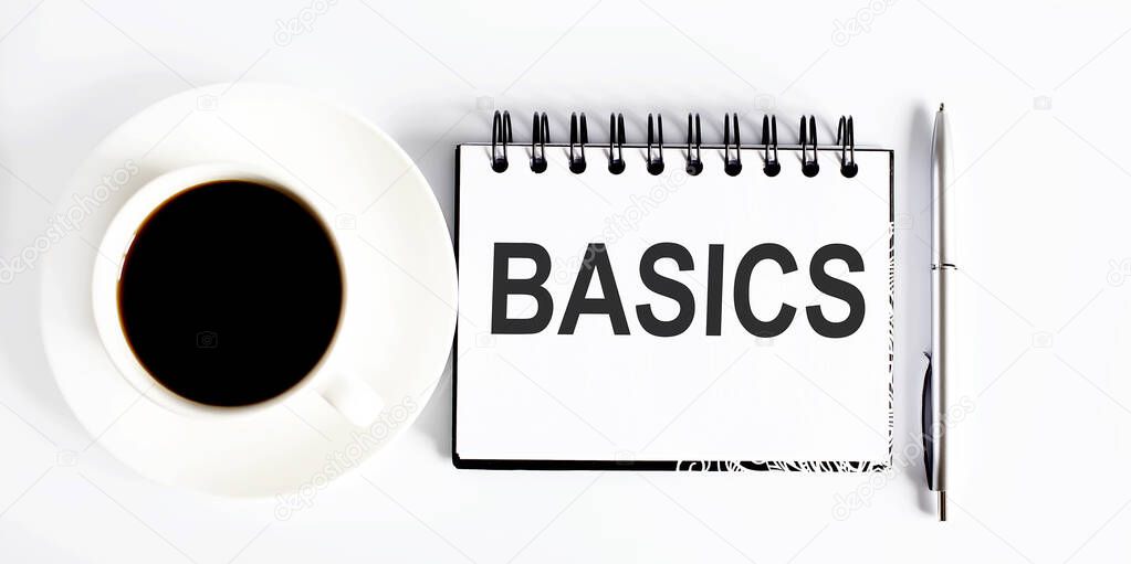 Basics . Spiral notebook with text on white background with coffee