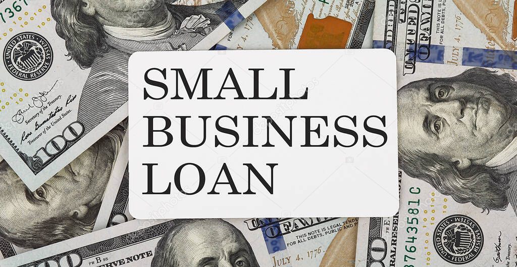 text SMALL BUSINESS LOAN on the dollars background