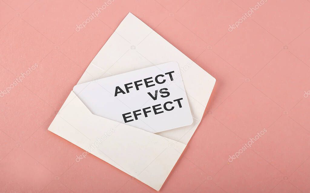 Word Writing Text Affect vs Effect on card on pink background