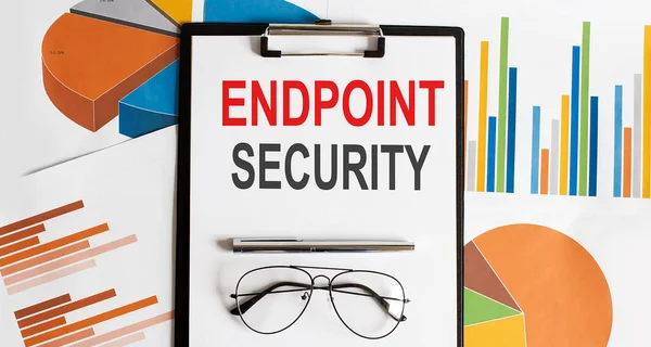 Endpoint Security . Conceptual background with chart ,papers, pen and glasses, business