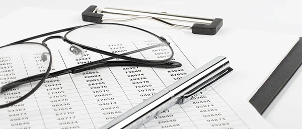 Business paper chart ,pen ,glasses on the white background