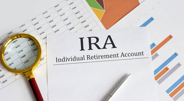 Paper with IRA on table with charts