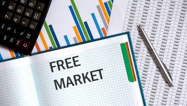 FREE MARKET not defterine kalem ve çizelge ile yazılmış bir not