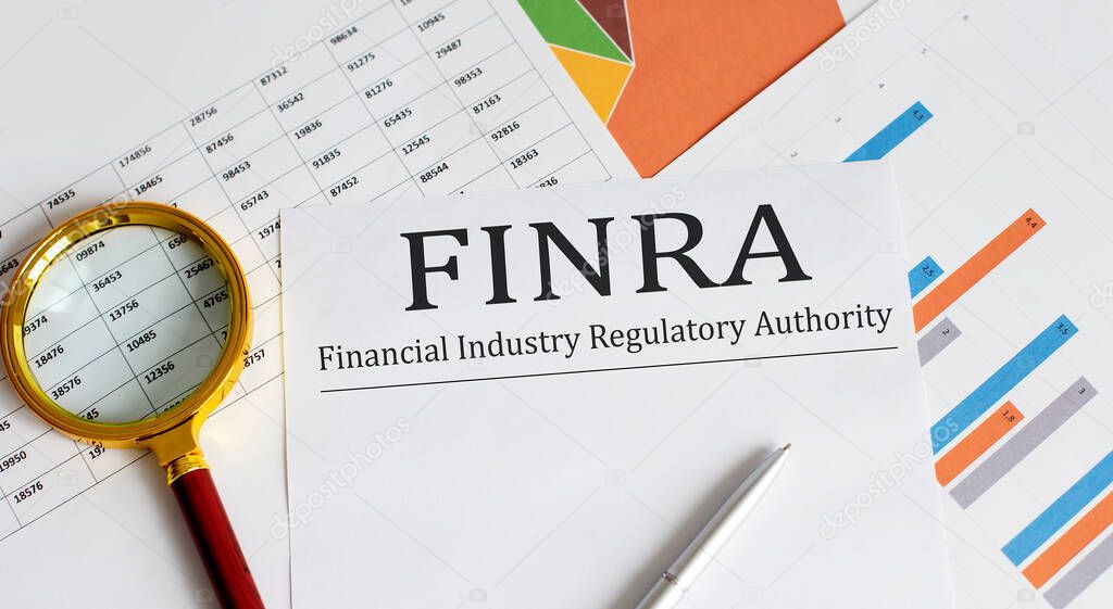 Paper with FINRA on a charts . Business concept