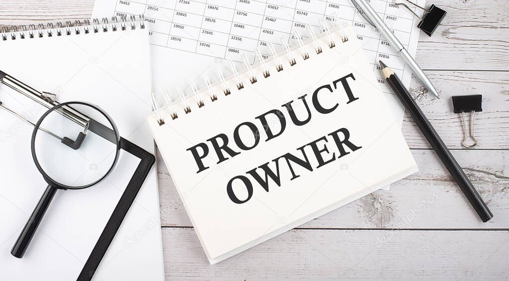 PRODUCT OWNER . Text written on the notepad with office tools and documents.