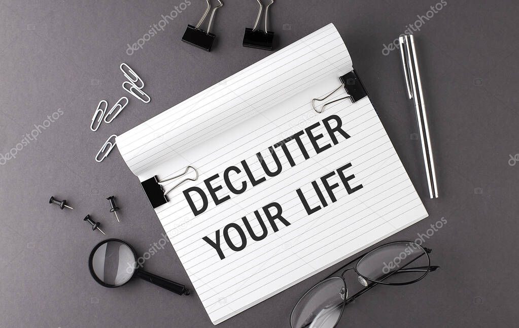Notebook with Tools and Notes with text DECLUTTER YOUR LIFE , business