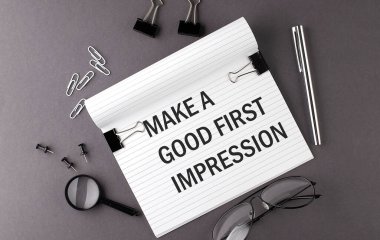Notebook with Tools and Notes with text MAKE A GOOD FIRST IMPRESSION , business