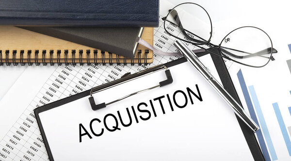 Text Acquisition on Office desk table with notebooks, supplies,analysis chart, on white background.