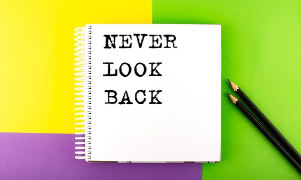 Minimal Work Space Sketchbook Colorful Background Never Look Back — Stock Photo, Image